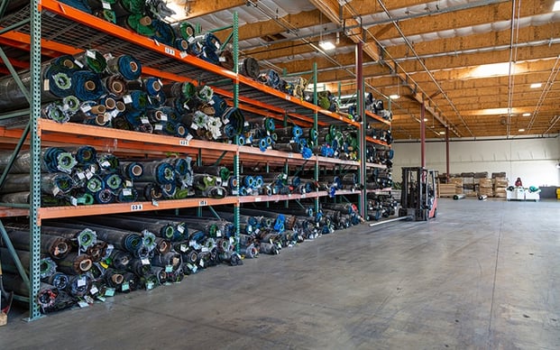 Rolls of artificial turf in the Biltright turf warehouse
