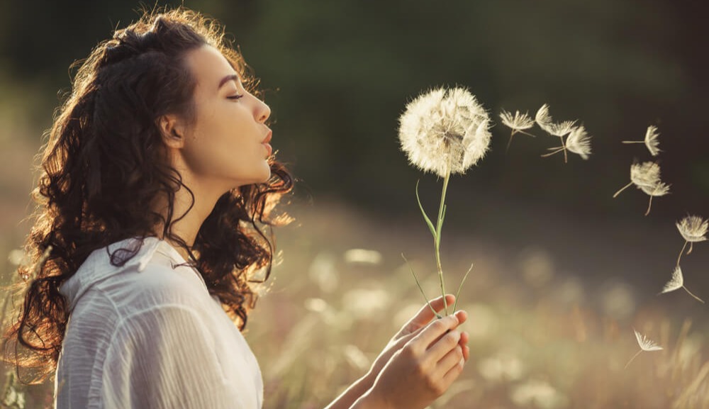 woman-blows-on-weed